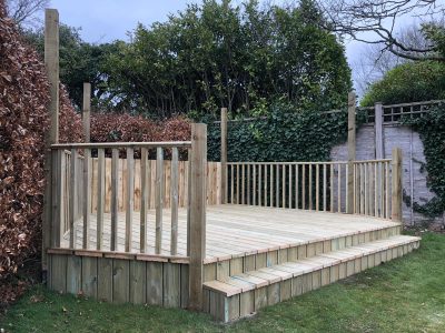 Decking area in garden with steps