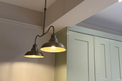 Two hanging ceiling lights in new character kitchen