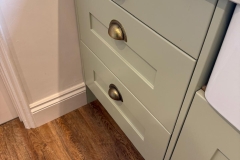 Detail of cabinet colour and contrasting brushed metal hardware