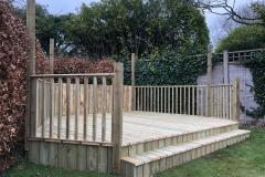 Decking area in garden with steps