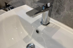 Monochrome bathroom white sink with chrome fixtures