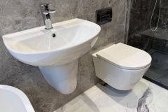 White, wall hung bathroom furniture with chrome fixtures