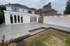 Large garden patio with steps