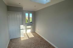 Room with sky light and window